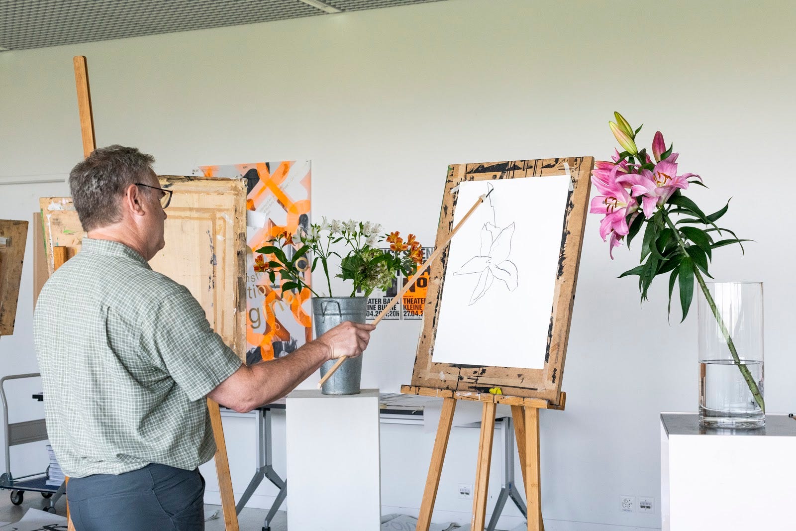 Drawing lilies with stick in hand