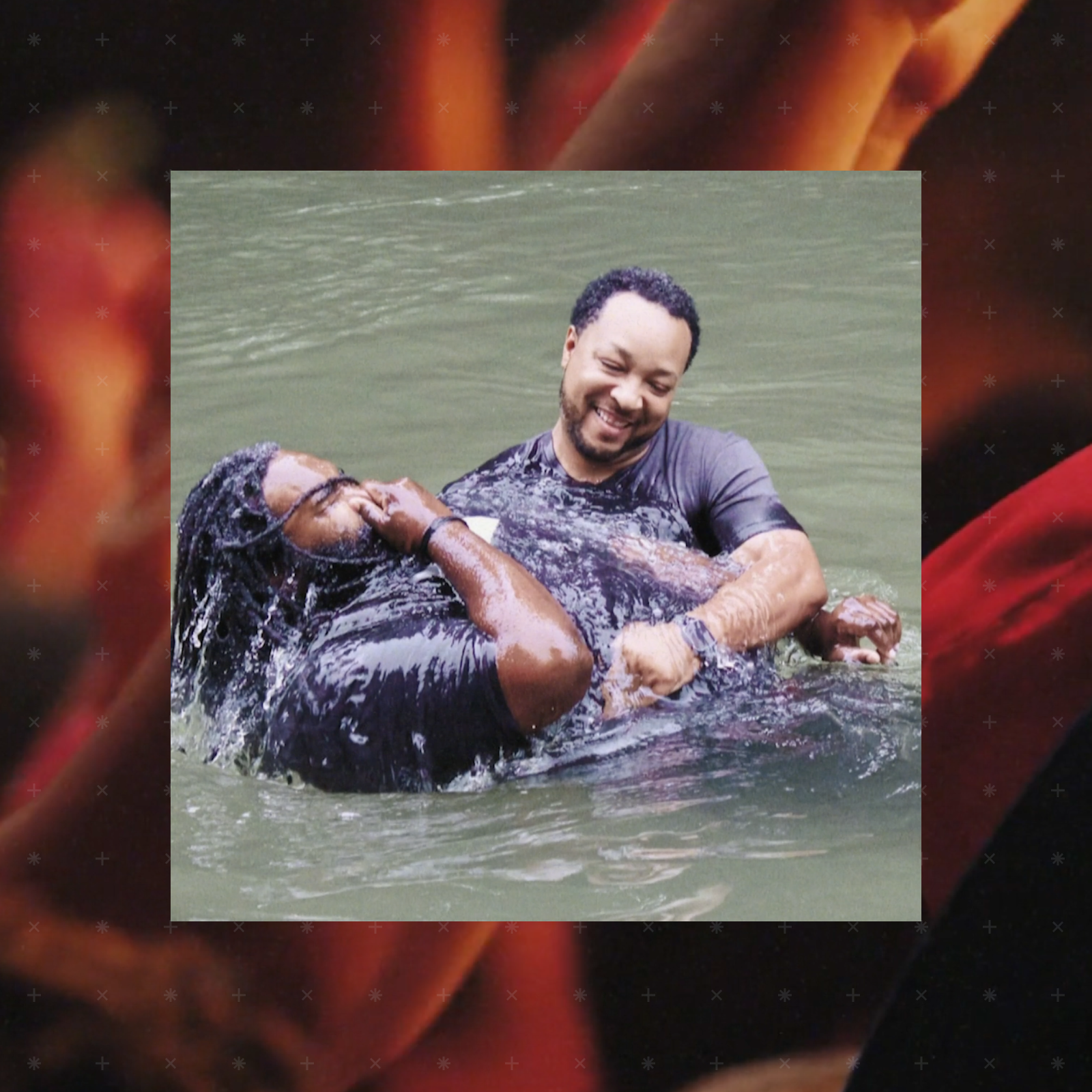 two men in a baptism in river