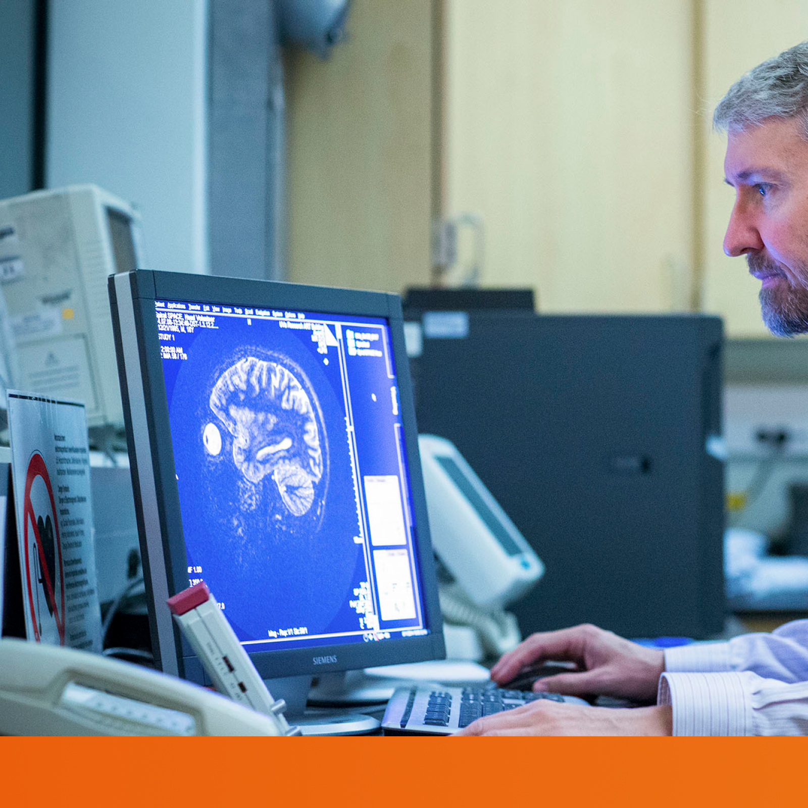 UVA researcher looking at a brain scan