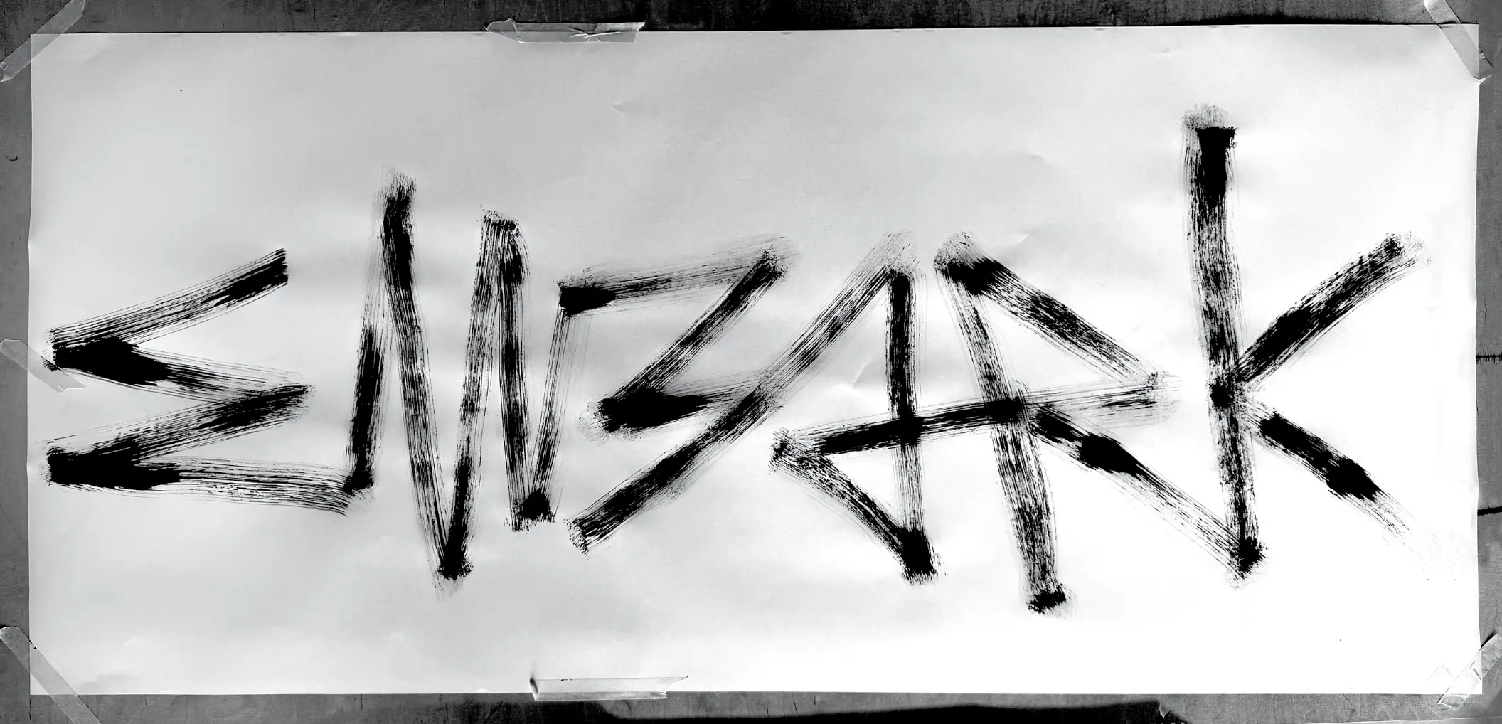 word embark written in brushstroke